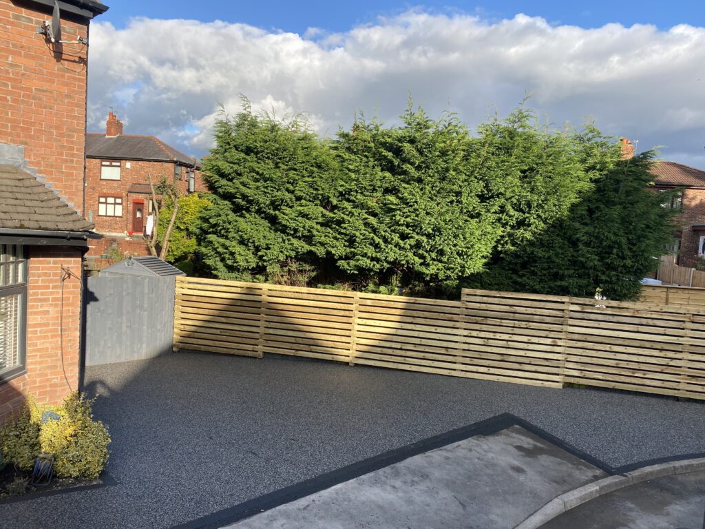 Eclipse resin driveway and pathway with new timber fencing in Ashton-under-Lyne