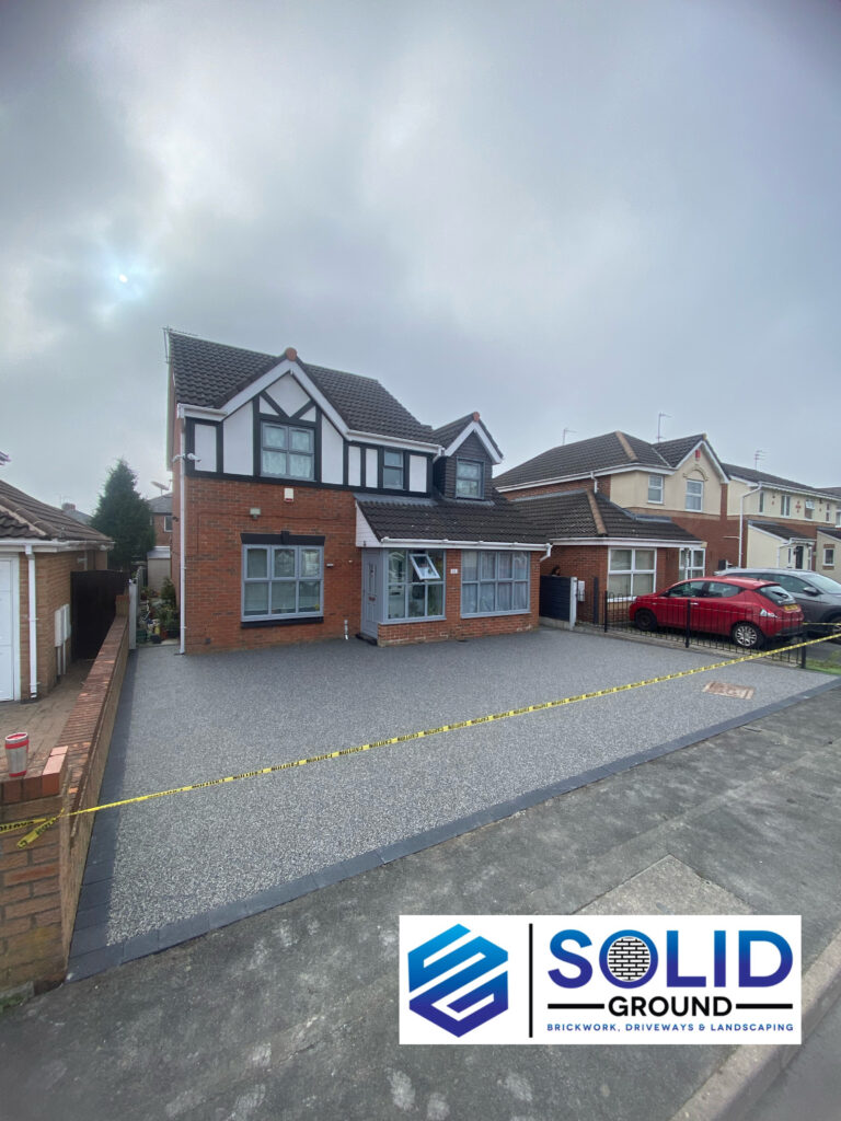 50m² bespoke grey resin driveway with charcoal borders in Ashton-under-Lyne