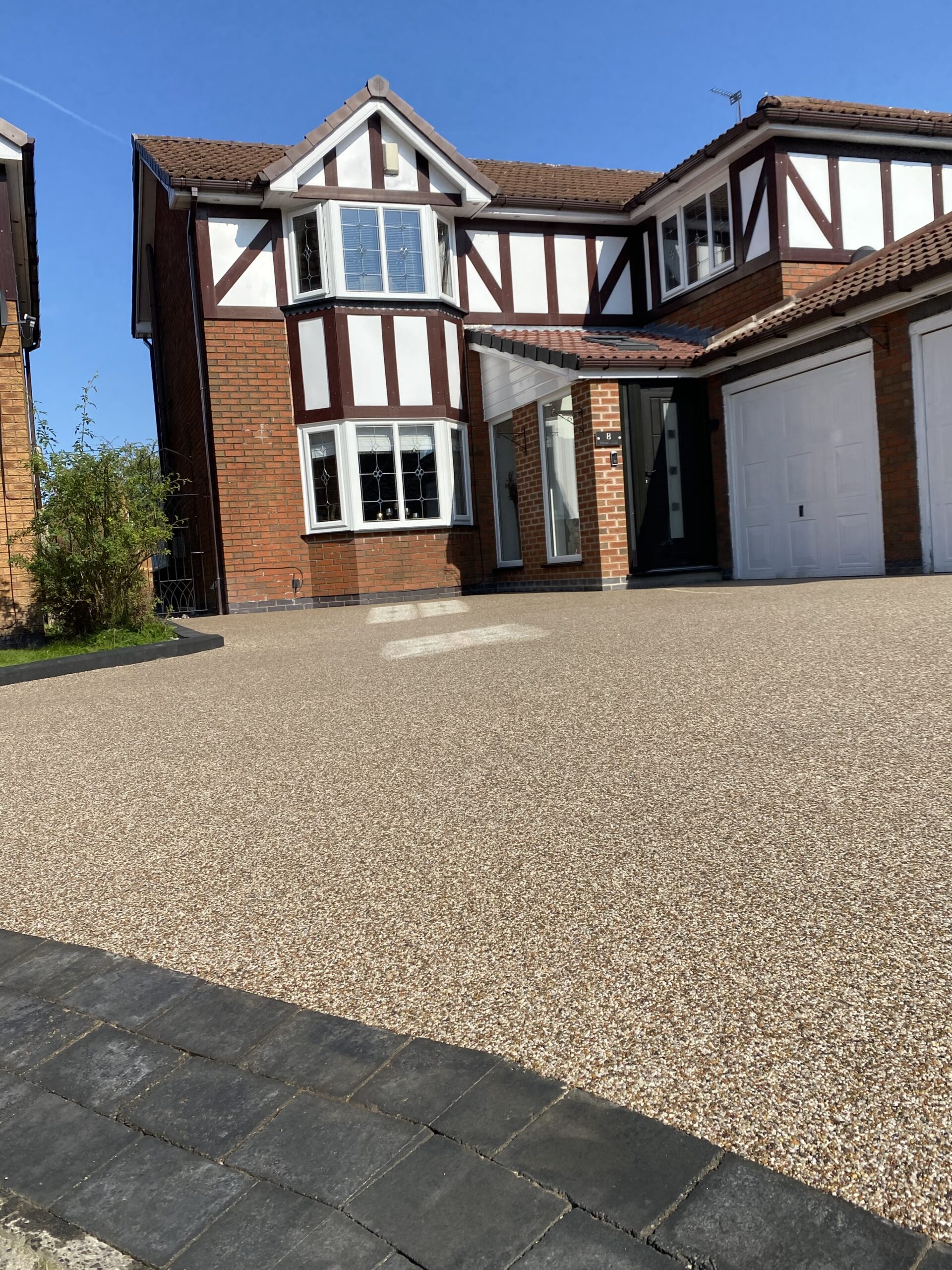 Completed Arizona resin driveway with glitter sparkle and charcoal edging in Newton, Hyde