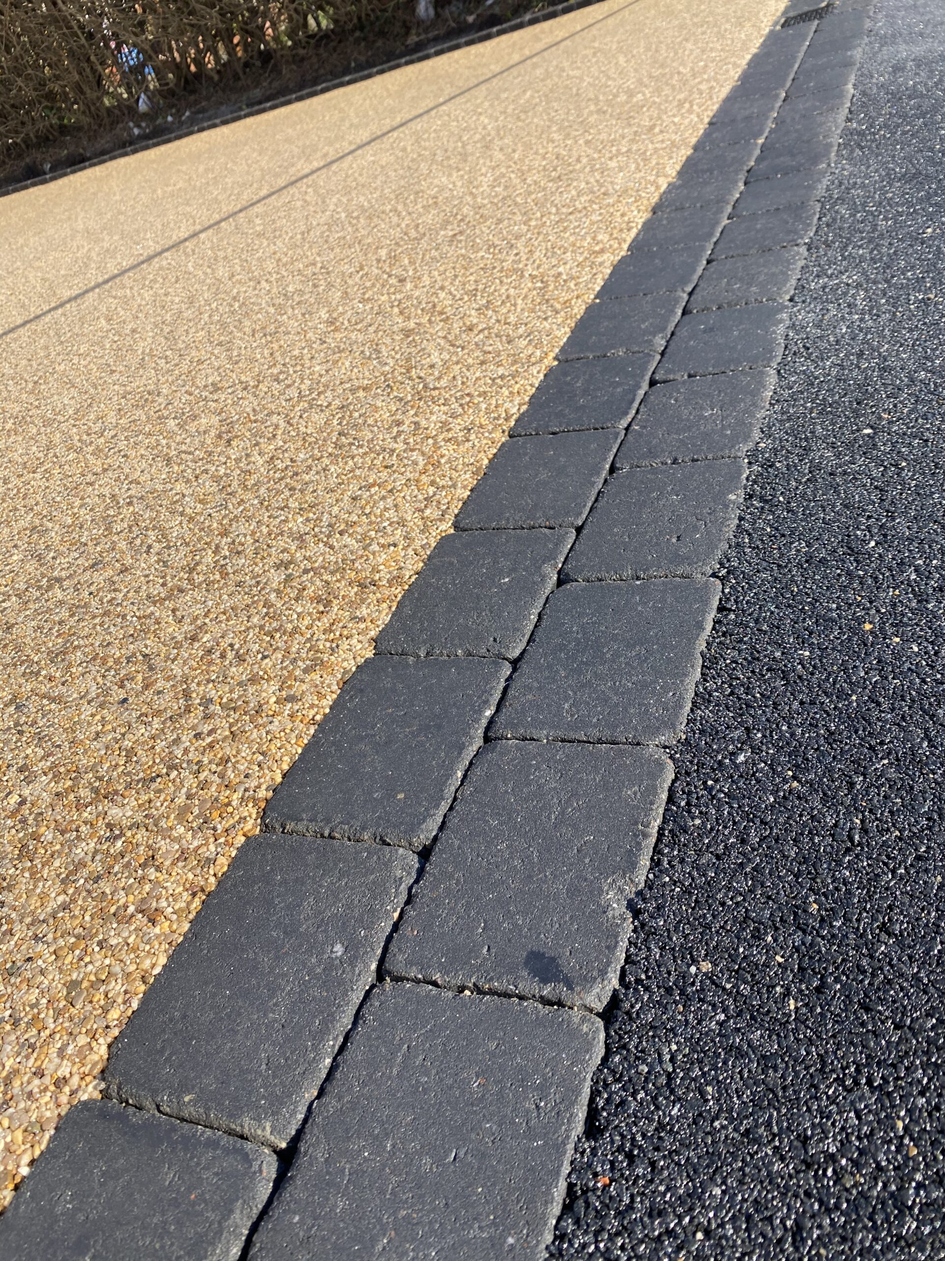 Ground preparation during full rip-out resin driveway installation in Ashton-under-Lyne