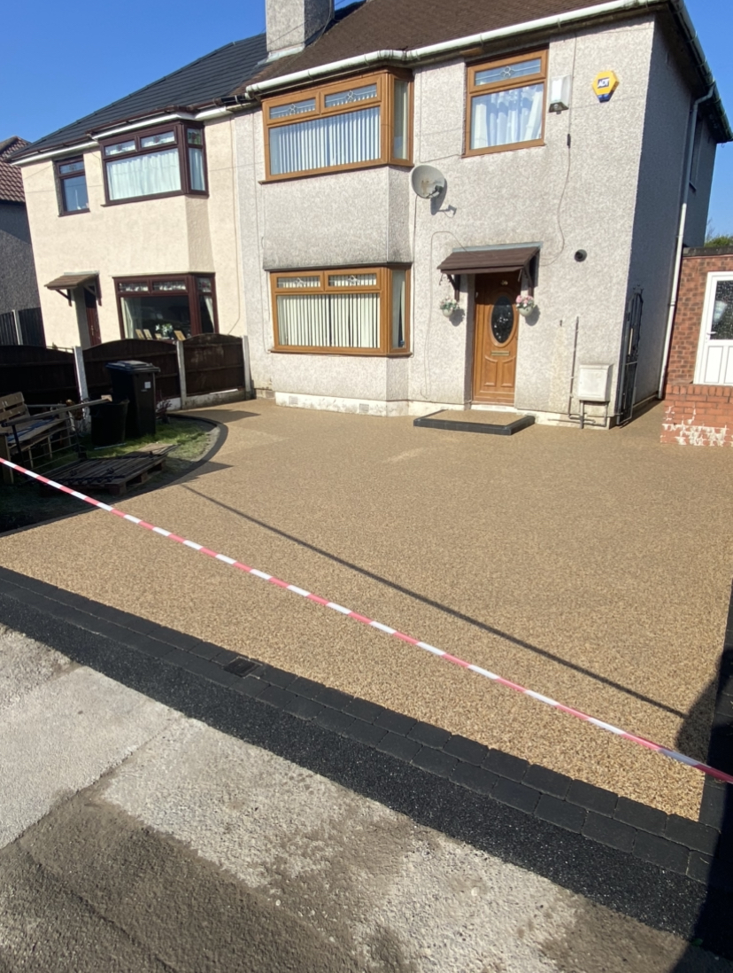 Aurora resin driveway with new entrance step and charcoal border blocks in Ashton-under-Lyne