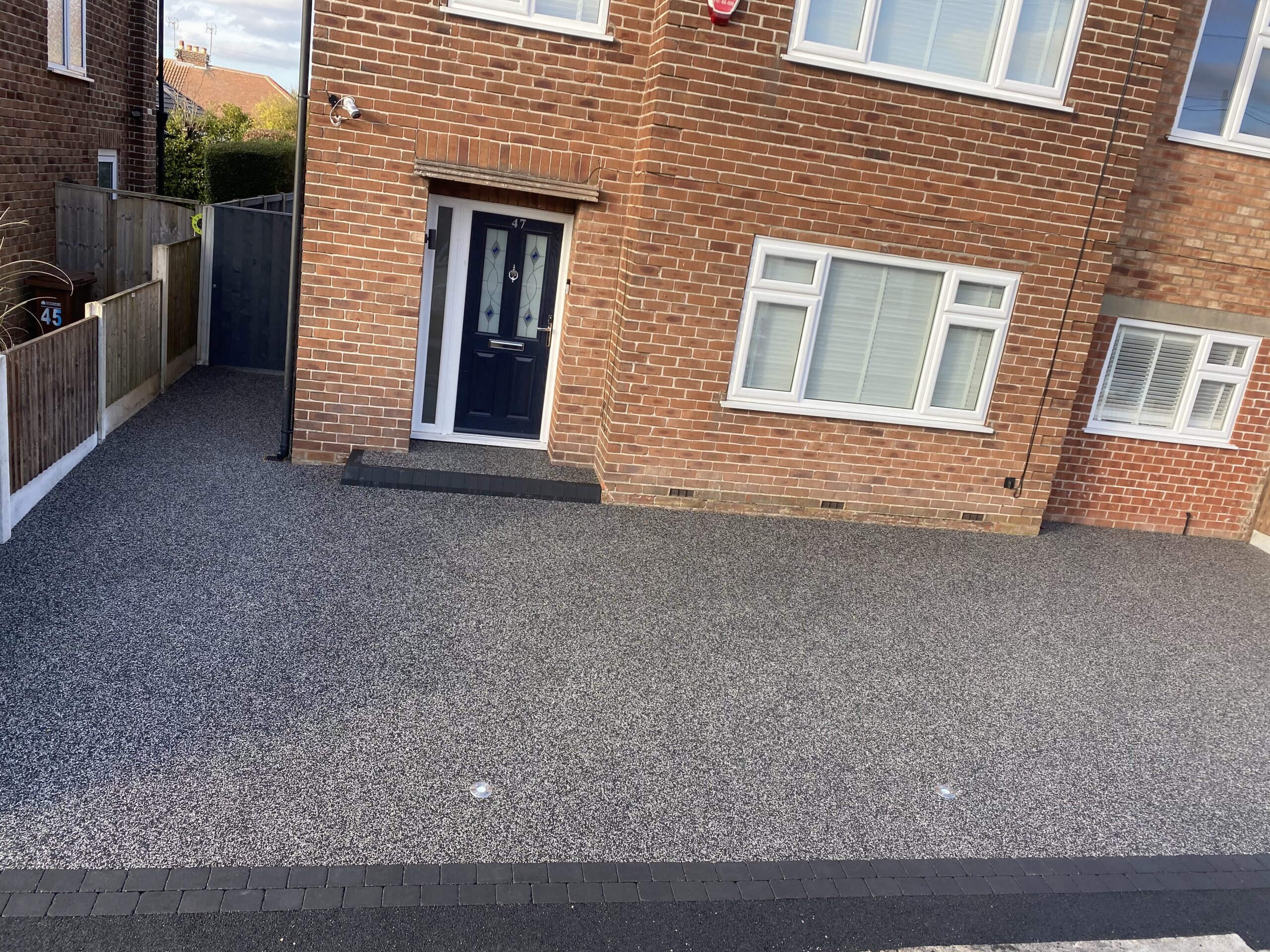 Finished Harlequin resin driveway with charcoal block border and LED lights in Hazel Grove, Stockport