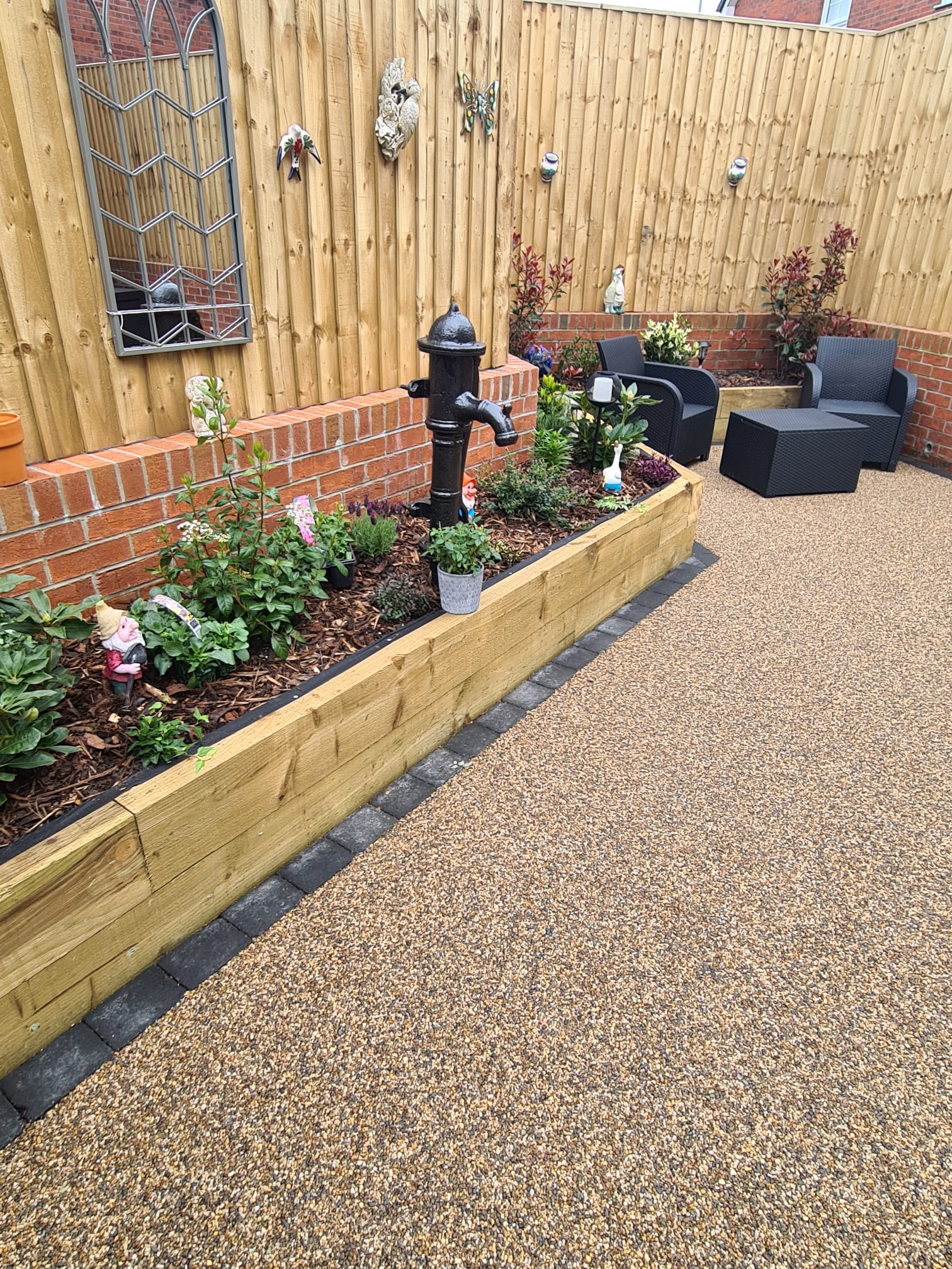 Cappuccino resin patio and raised sleeper planting beds in Hattersley Hyde