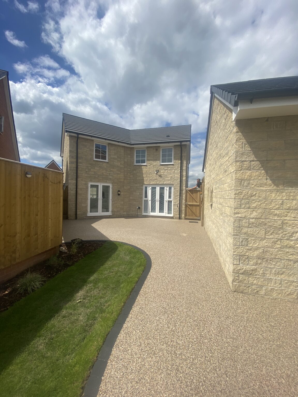 Finished 32m² Arizona resin patio in Hattersley Hyde with sweeping charcoal block edging