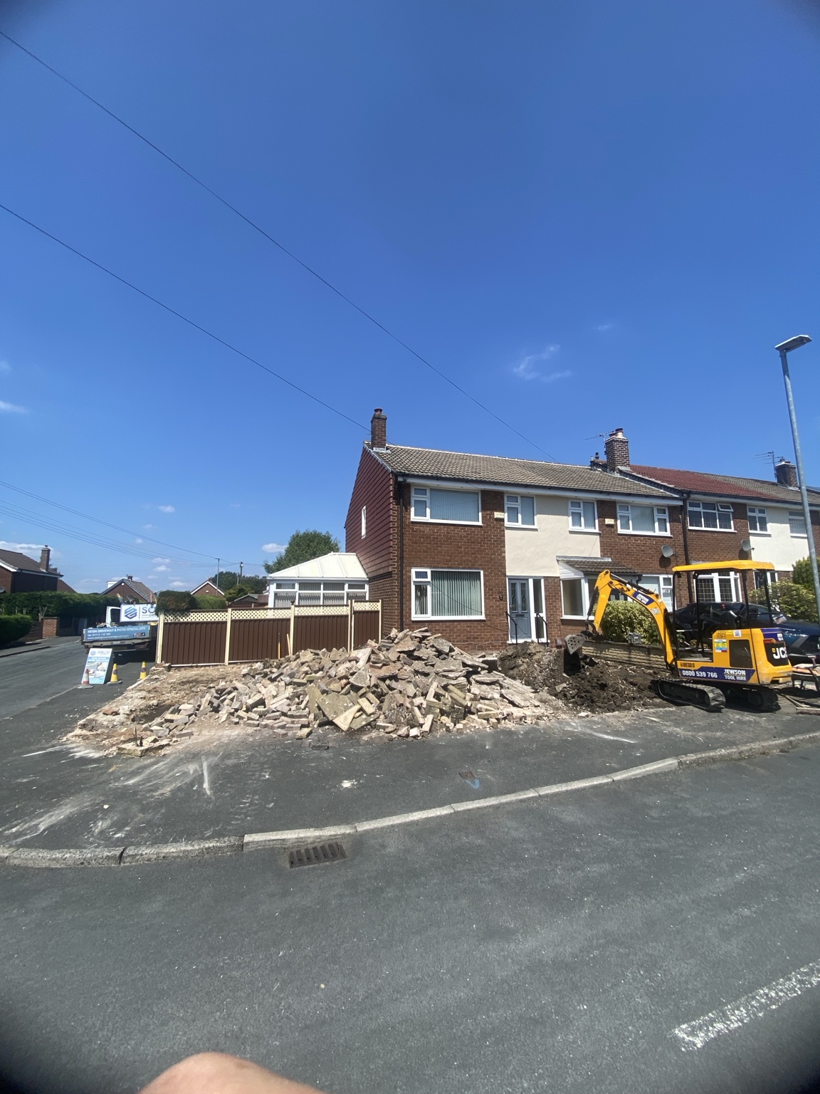 Full excavation and removal of an existing driveway before resin installation