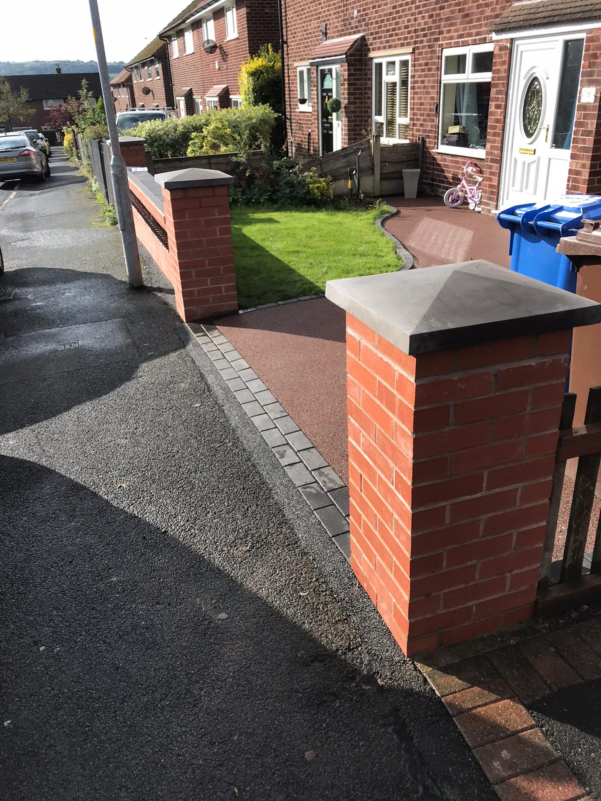 Completed Sorrento resin driveway and new garden wall in Newton, Hyde with charcoal edging blocks