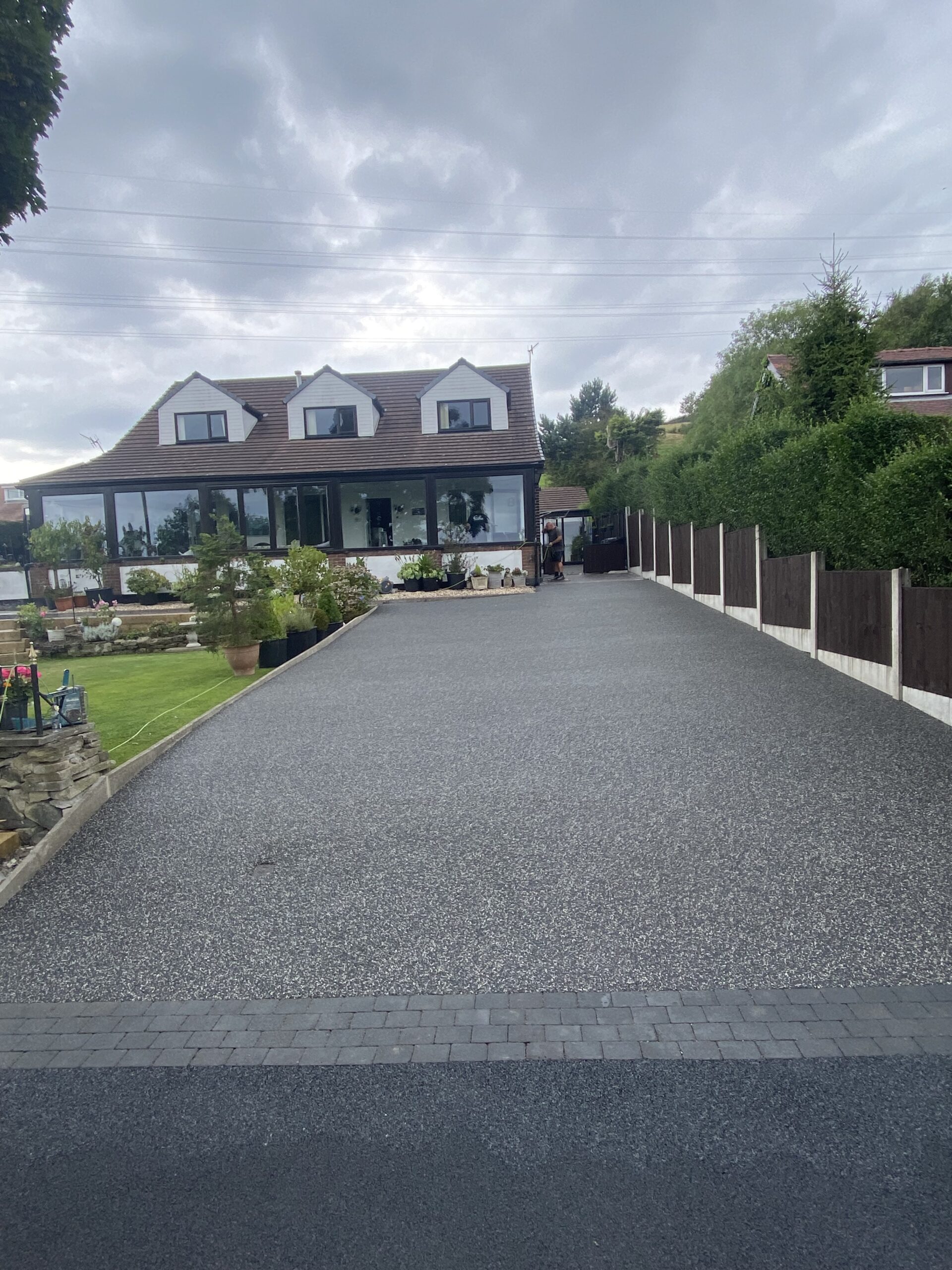 Warm-toned resin patio after installation in Stalybridge