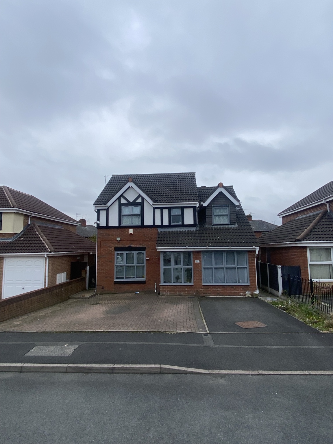 Original block-paved and tarmac driveway before a 45m² full dig-out resin installation in Ashton-under-Lyne