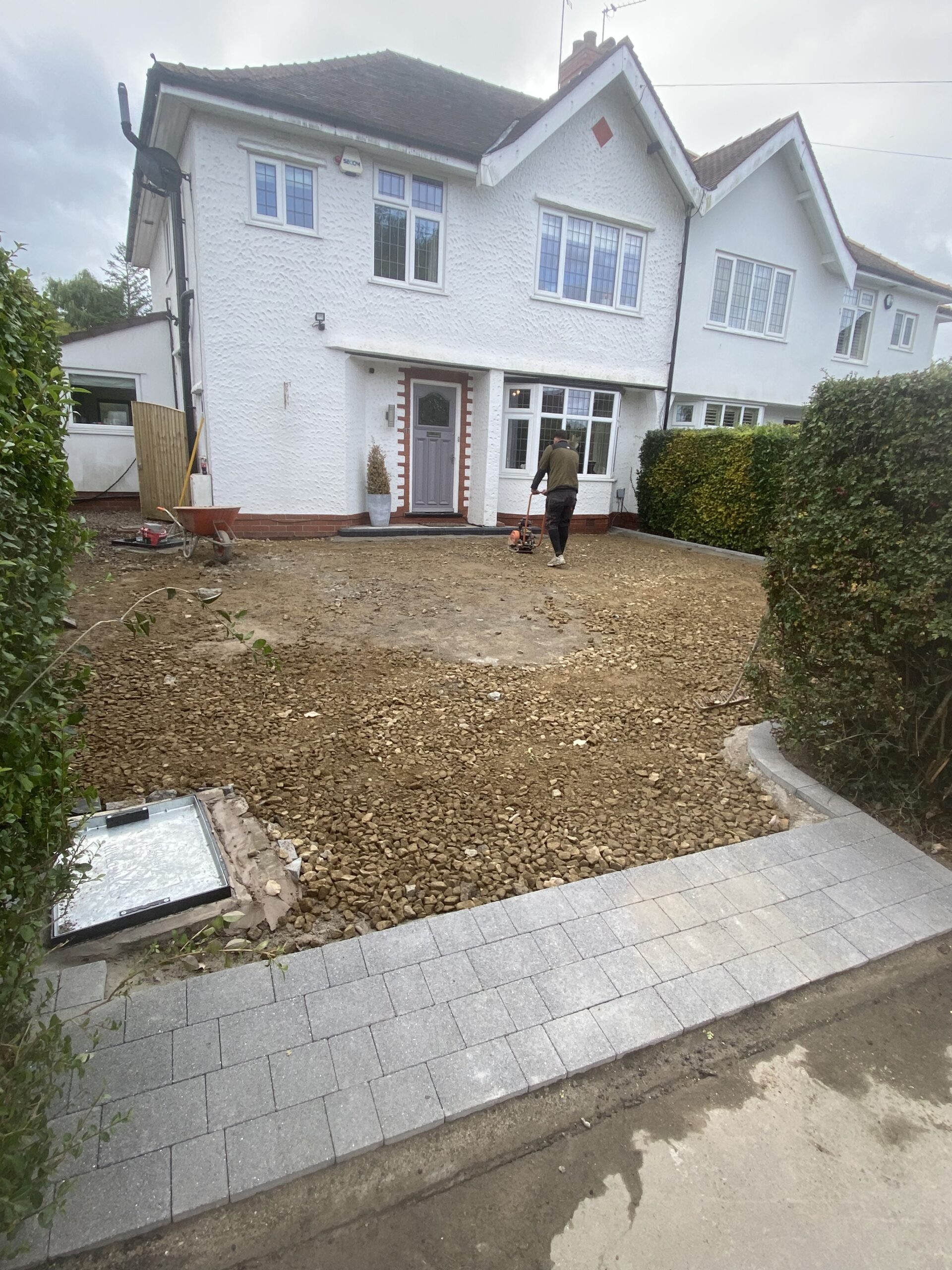 Ground preparation and new charcoal entrance edging for Bramhall resin driveway