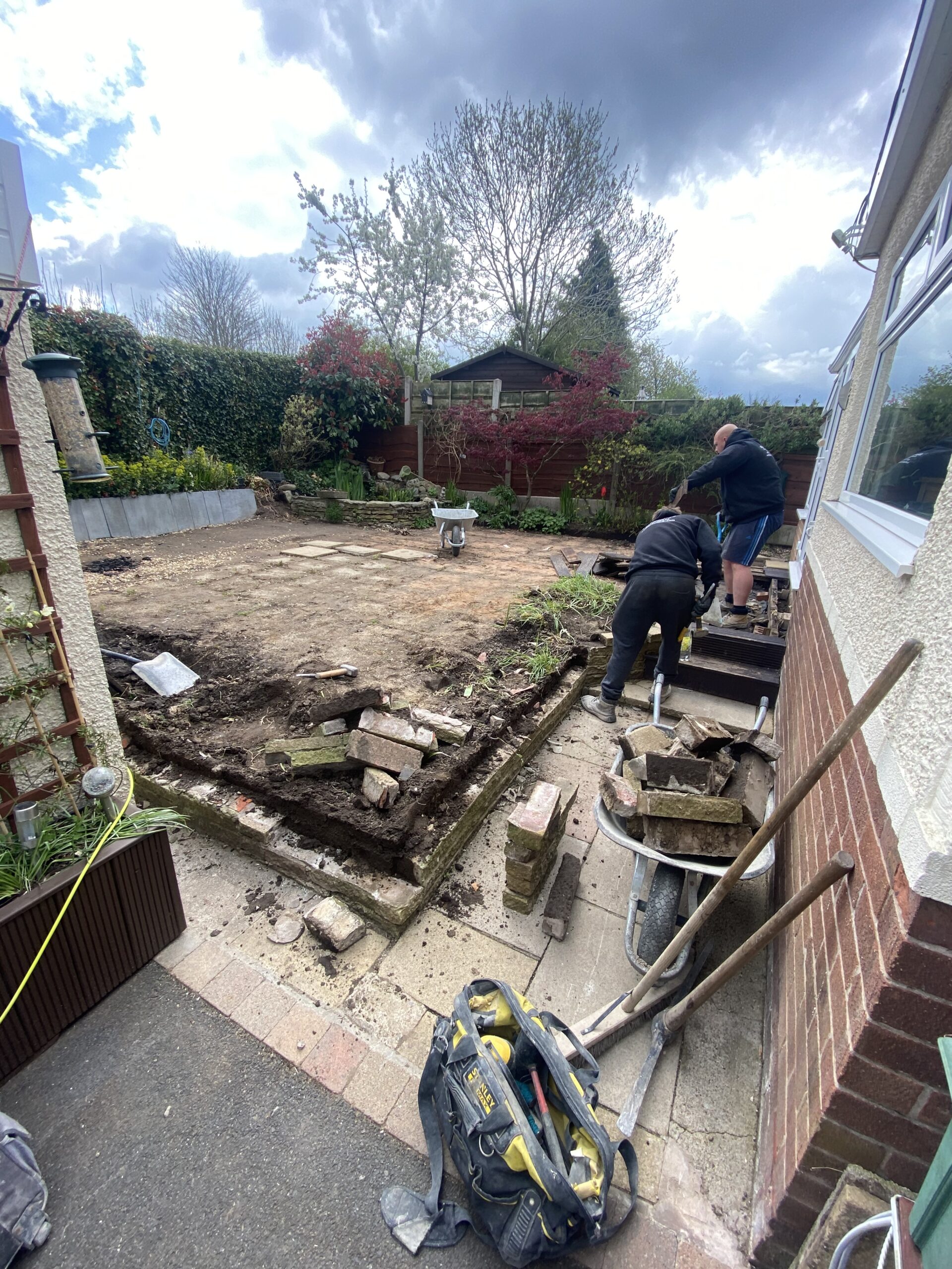 Bredbury garden before 36m² Sienna resin patio transformation