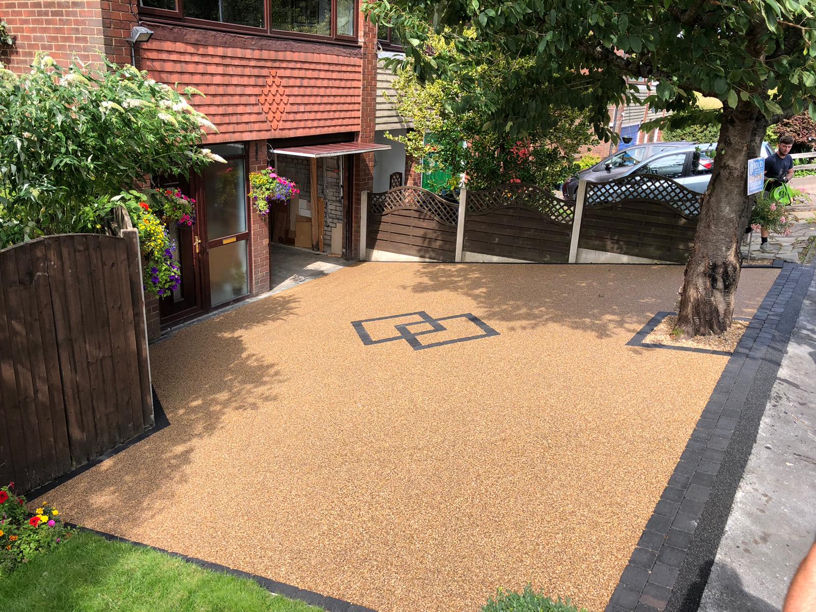 Completed 55m² Sienna resin-bound driveway in Stalybridge with charcoal block border
