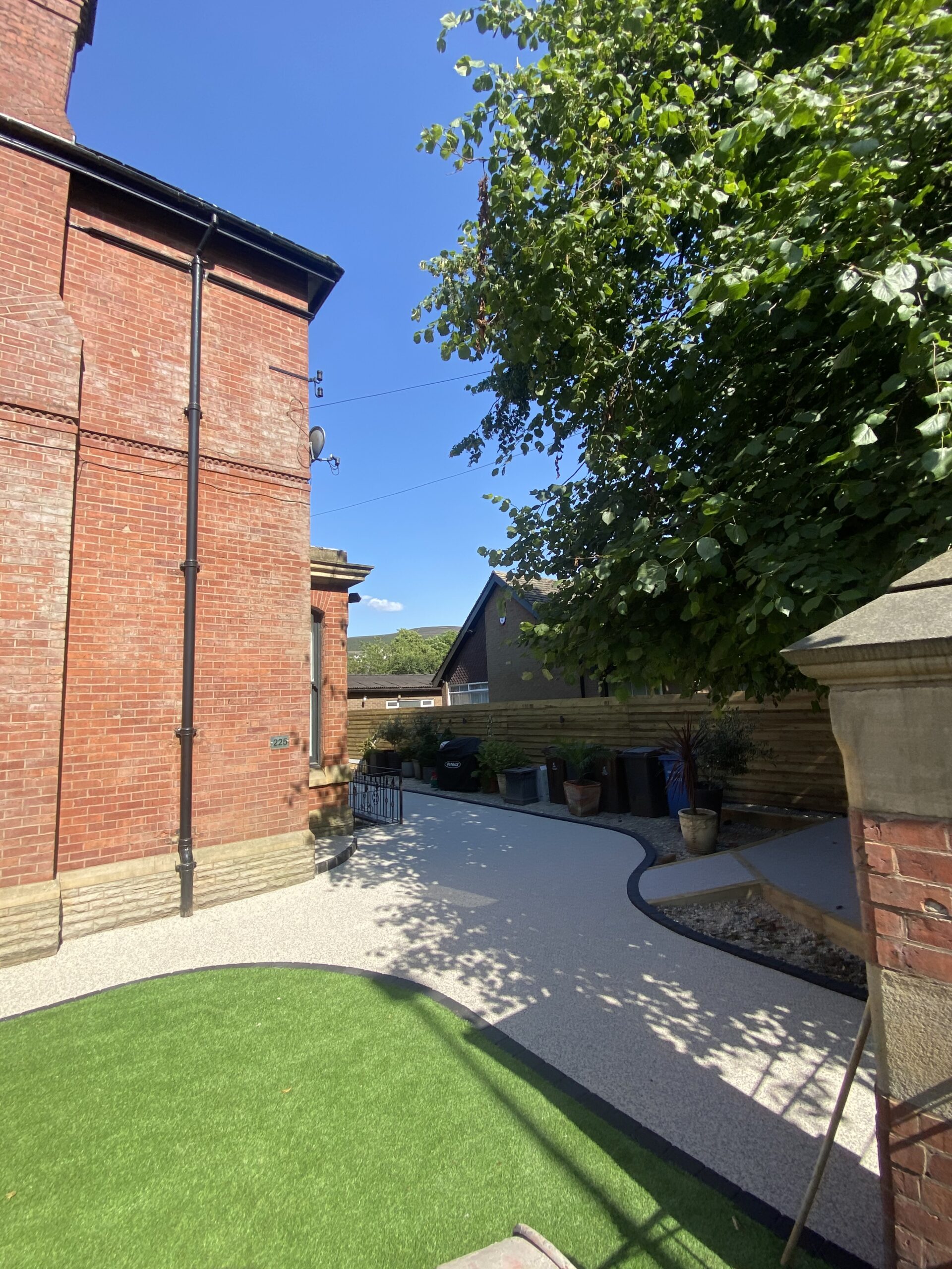 Completed Stalybridge garden transformation with resin patio, steps and artificial grass
