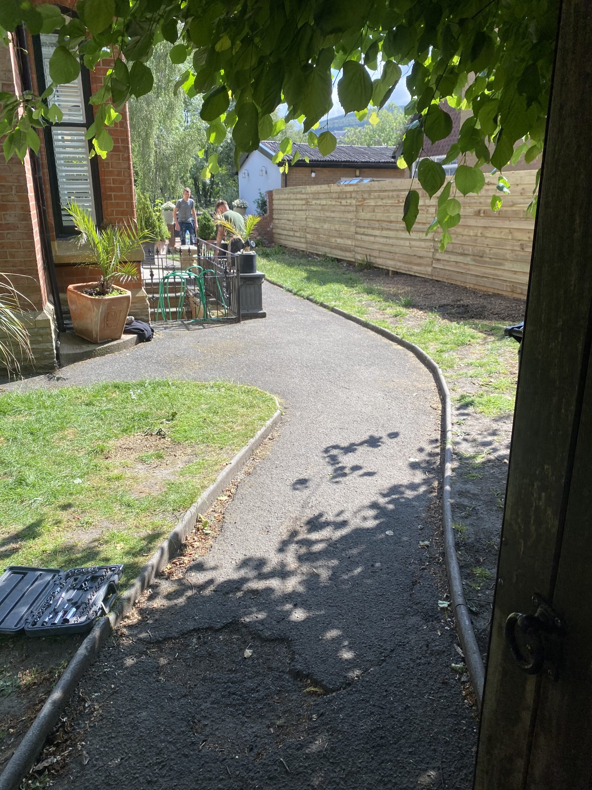 Resin patio steps in Stalybridge finished with bespoke Spanish marble blend and charcoal edging