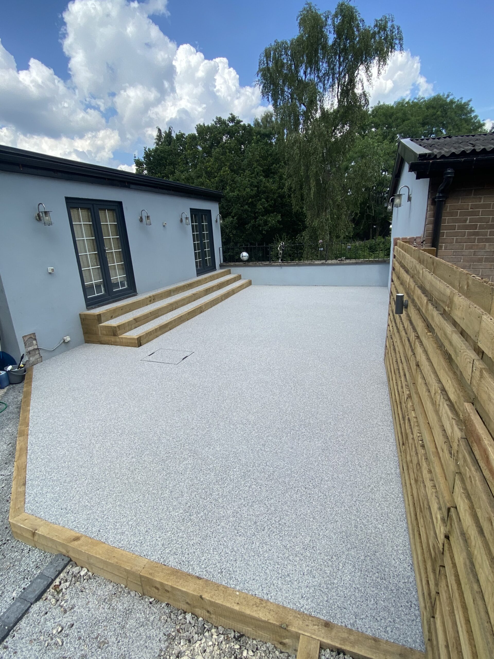 Stalybridge garden transformation with resin patio areas and bespoke Spanish marble blend